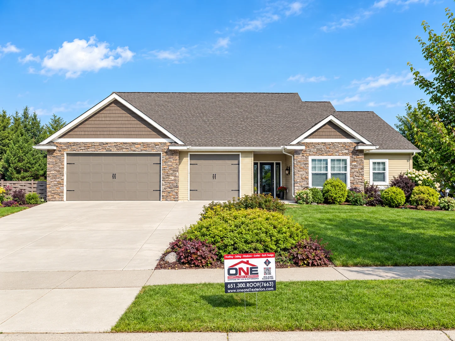 Completed shingle roof on a single-story home with a One Nation Exteriors yard sign