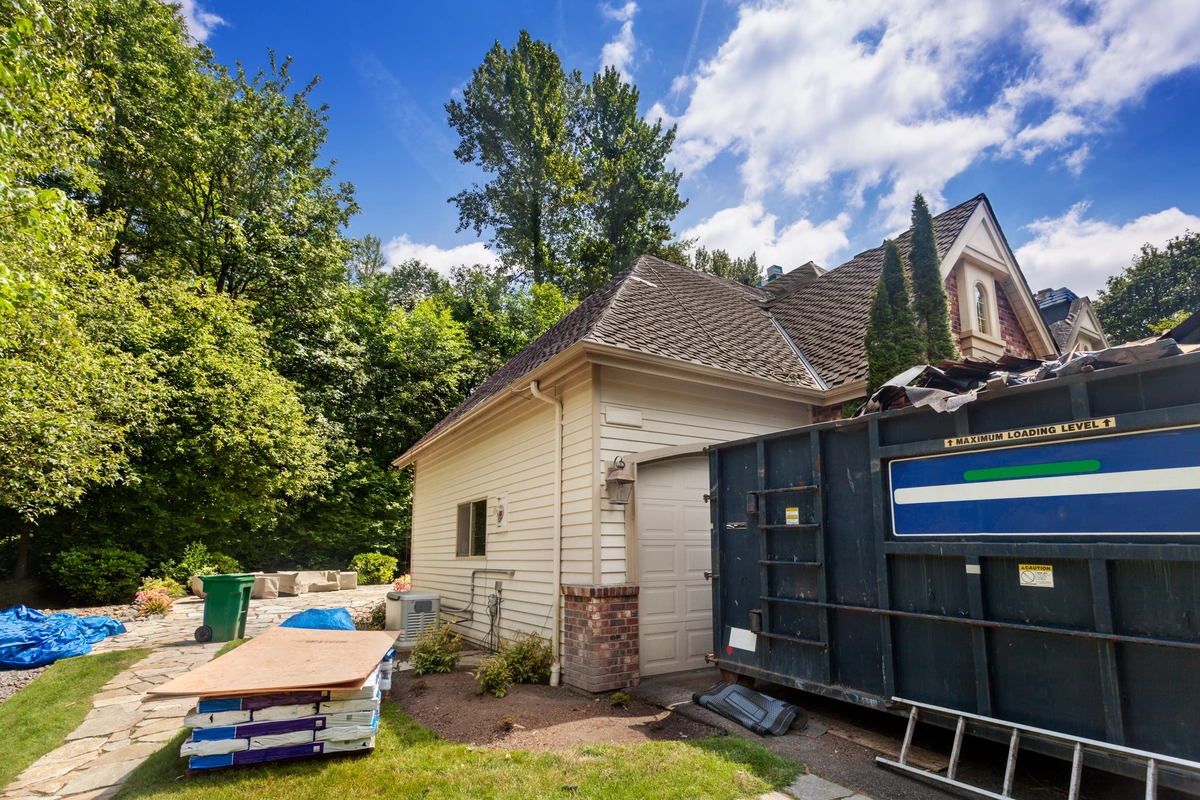 construction materials around the side of a home