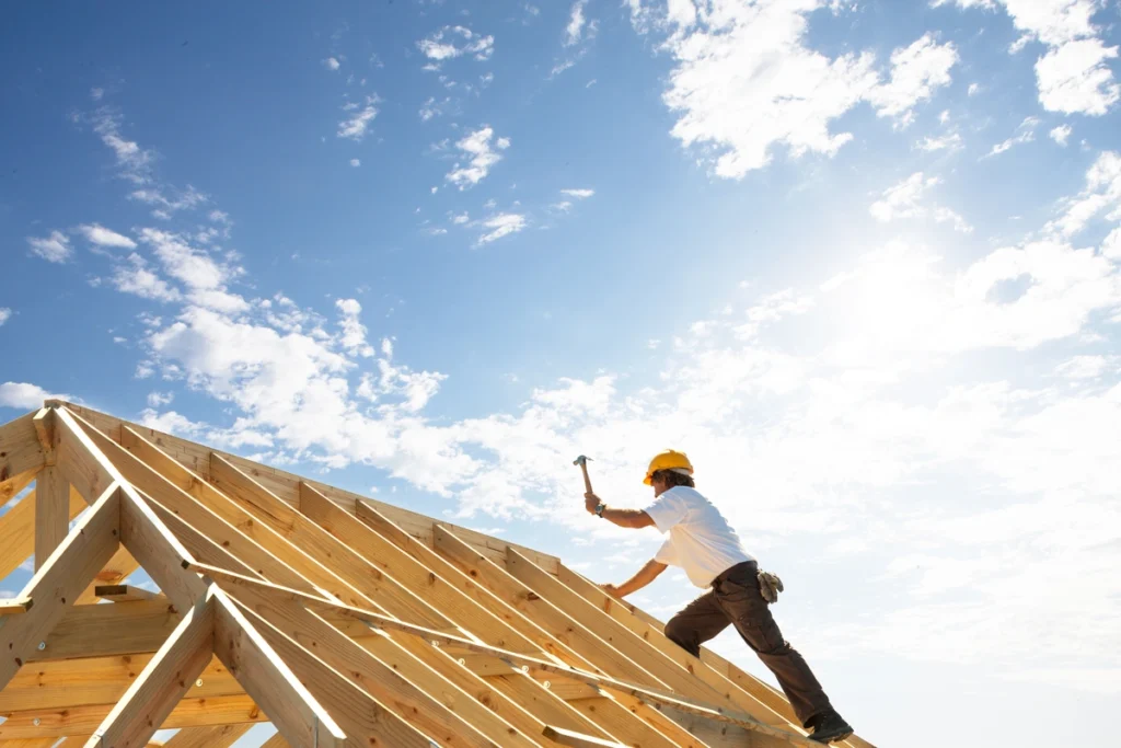 Roof technician installing roof on a home