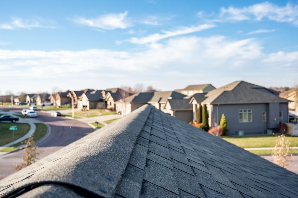 view of the peak of a roof overlooking a neighborhood